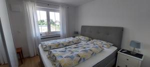 Un pat sau paturi într-o cameră la Ferienwohnung Haisterkirch