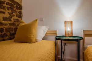 Cama ou camas em um quarto em Albergue do Infante