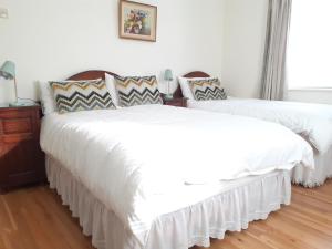 Ένα ή περισσότερα κρεβάτια σε δωμάτιο στο Conways B&B
