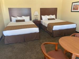 Postel nebo postele na pokoji v ubytování Southern Inns And Suites now offering RV Spaces for rent