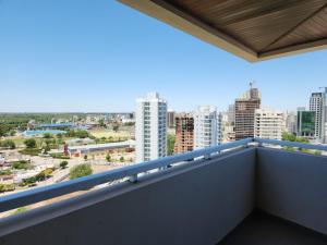 a balcony with a view of the city at TORRE MAFALDA 15 Departamento nuevo con Pileta in Río Cuarto