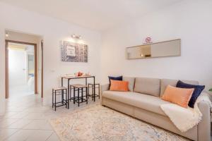 a living room with a couch and a table at Balsamico Feelings near City Centre in Modena