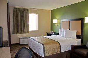 a hotel room with a bed and a window at Extended Stay America Suites - Houston - Sugar Land in Sugar Land