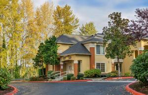 a house with a driveway in front of it at Extended Stay America Suites - Seattle - Bellevue - Factoria in Bellevue