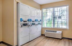 a kitchen with white appliances and a window at Extended Stay America Suites - Seattle - Bellevue - Factoria in Bellevue