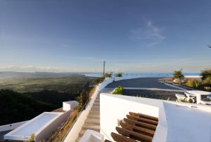 a white house with a view of the ocean at Adults Only! Ocaso Luxury Villas Entire Property in Rincon