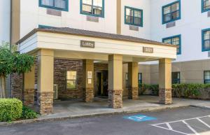 a building with a parking lot in front of it at Extended Stay America Suites - Seattle - Lynnwood in Lynnwood
