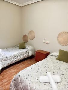 Postel nebo postele na pokoji v ubytování Piso Centrico En Linares + 8 fotografií