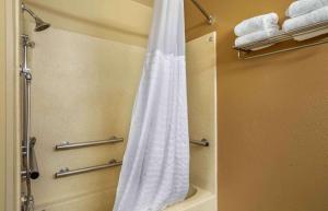 a shower curtain in a bathroom with towels at Extended Stay America Suites - Nashville - Brentwood - South in Brentwood
