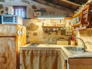 a small kitchen with a sink and a microwave at Live Arico Lagar in Arico el Nuevo