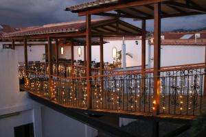 a balcony with a bunch of lights on it at Hospederia Villa de los Sáenz in Villa de Leyva