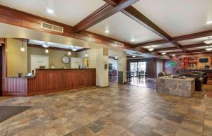 a large lobby with a waiting room and a reception desk at Extended Stay Americas Suites - Minot in Minot
