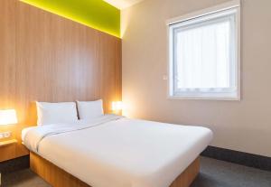 Postel nebo postele na pokoji v ubytování B&B HOTEL Limoges Centre Gare