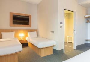 Postel nebo postele na pokoji v ubytování B&B HOTEL Limoges Centre Gare