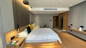Postel nebo postele na pokoji v ubytování Lanshan Moon Resort