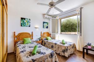 Ένα ή περισσότερα κρεβάτια σε δωμάτιο στο Villa Urano by Villa Plus +22 φωτογραφίες