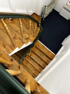 an overhead view of a staircase with wood floors at Hotel Krasnoludki in Sosnówka