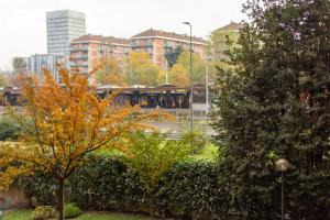 a view of a park with trees and buildings at Crescenzago#34, vicino Metro M2 e Ospedale San Raffaele in Milan