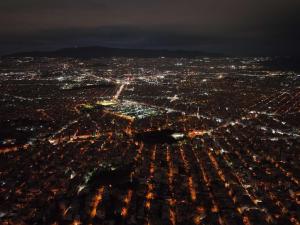 an aerial view of a city at night at Maria’s Home in Piraeus