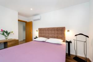 Ein Bett oder Betten in einem Zimmer der Unterkunft Villa NIKA