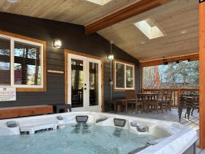 a large bath tub in the middle of a house at Compass Cabin by NW Comfy Cabins in Leavenworth