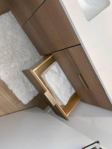 a wooden cabinet with a drawer in a room at Full Kitchen-youtubetv-smart Locksking Bedtop Fl in Tacoma