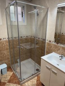 a bathroom with a shower and a sink at El Gengo Suite in Madrid