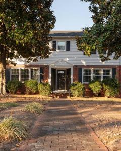 a house with a brick walkway in front of it at Fernwood Manor in High Point