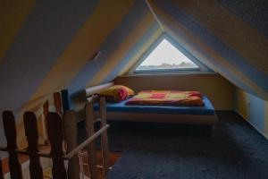 Ένα ή περισσότερα κρεβάτια σε δωμάτιο στο Ferienwohnung-Bordesholm / Inh. Fam. Gabriel