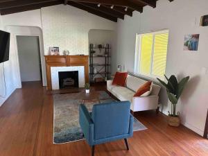 a living room with a couch and a fireplace at Luxury Stay- Brickell & Little Havana/ItalianPlaza in Miami