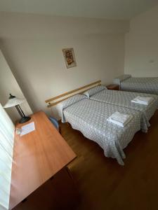 Posteľ alebo postele v izbe v ubytovaní Casa Diocesana VIA LUCIS