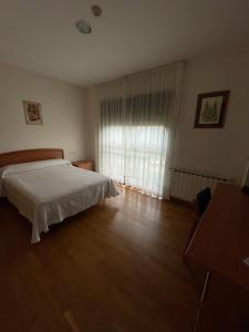Posteľ alebo postele v izbe v ubytovaní Casa Diocesana VIA LUCIS