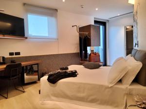 TV a/nebo společenská místnost v ubytování Panorama Hotel Friuli - Boutique Hotel