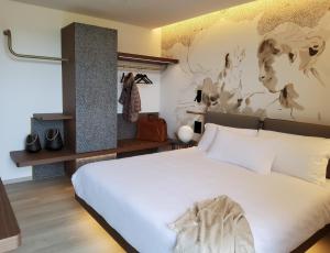 Postel nebo postele na pokoji v ubytování Panorama Hotel Friuli - Boutique Hotel