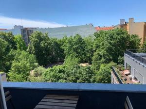 a view from the balcony of a building with trees at Rising Berlin in Berlin