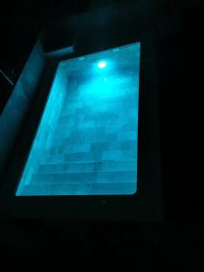 a tablet screen with a pool of water in the dark at LOS MIRLOS in Navaluenga