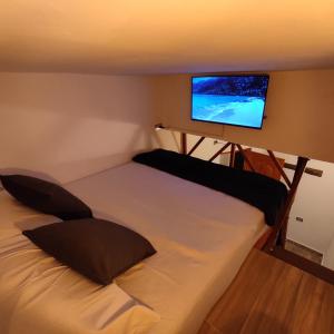 Postel nebo postele na pokoji v ubytování Hospedaje Oasis Blue Laureles Medellín