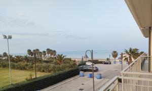 a view of the beach from the balcony of a condo at Casa Del Mar in Roseto degli Abruzzi
