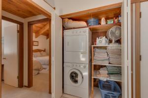 a laundry room with a washer and dryer at Base Camp- Hot Tub, Large Deck, Wood Fireplace, Short Drive to Ski Resorts! in Tahoe City