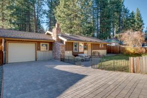 a house with a driveway and a garage at Stateline Home about 2 Mi to Tahoe Beaches in Stateline