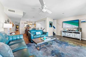 a living room with a couch and a table at Fanta-Sea 55 in Siesta Key