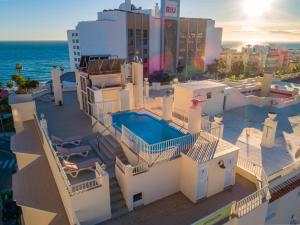 an aerial view of a house with a swimming pool at Apartamentos Solset Nerja in Nerja