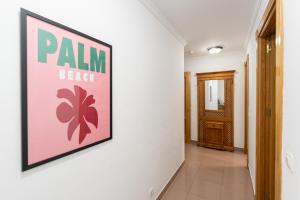 a hallway with a sign on a wall at Apartamentos Solset Nerja in Nerja