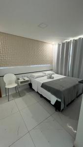 Postel nebo postele na pokoji v ubytování Goiana Palace Hotel - Fácil Acesso a Fábrica da JEEP