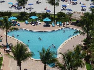 an overhead view of a swimming pool with people in it at Tides on Hollywood Beach in Hollywood