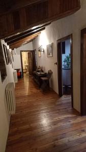 a hallway of a house with a wooden floor at B&B La Tour de Villa in Aosta