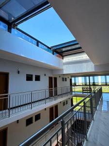 an empty building with a large window in the ceiling at Hotel Amaromar in Pontal do Paraná
