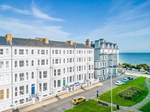 an aerial view of a white building next to the ocean at West Rocks Townhouse in Eastbourne