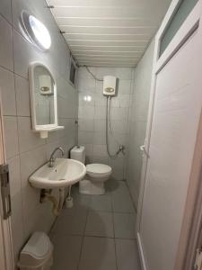 a small bathroom with a toilet and a sink at *Downtown* Furnished Flat [Mounthly Discount] D3 in Antalya