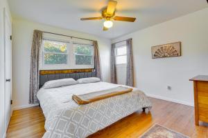 a bedroom with a bed and a ceiling fan at Hocking Hills Hideaway with Hot Tub and Fire Pit! in Logan